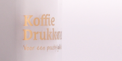 Close-up echt goud bedrukking op glas
